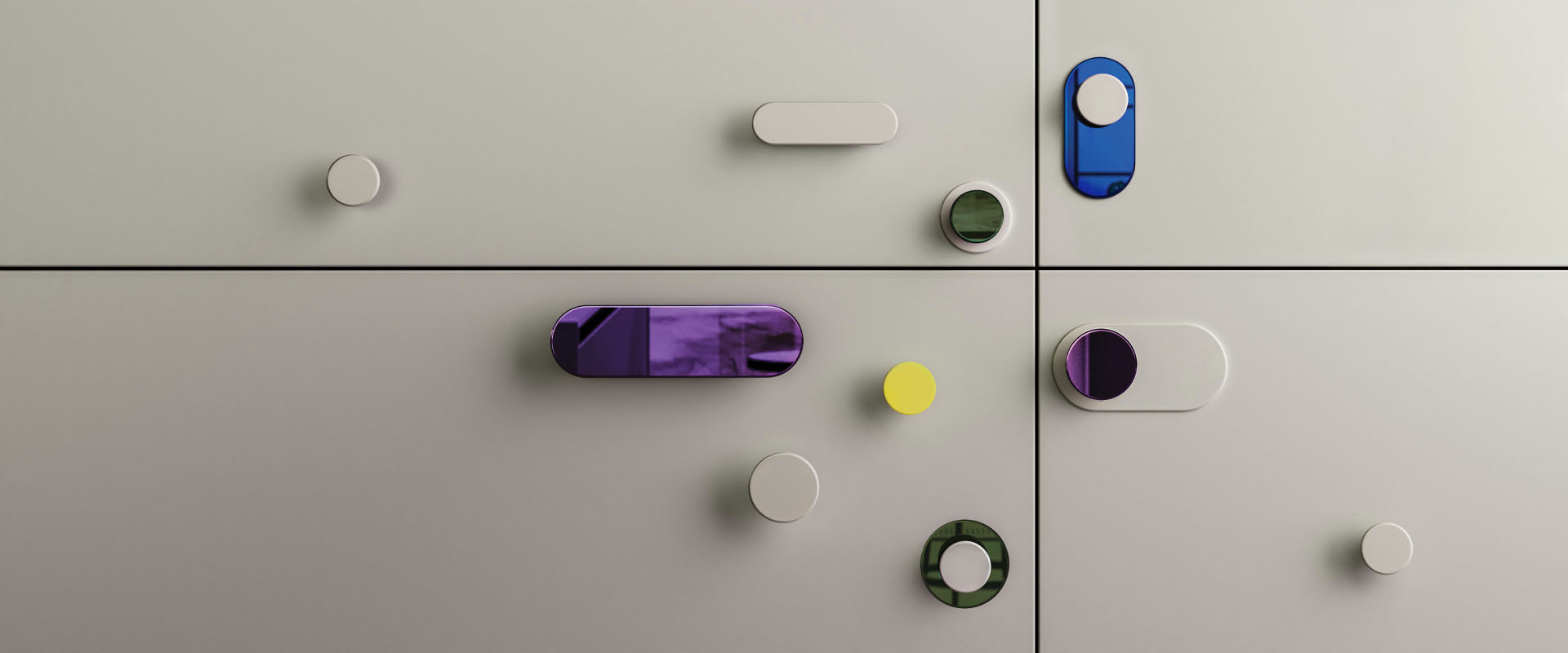 Colorful geometric handles in various shapes on light cabinets.